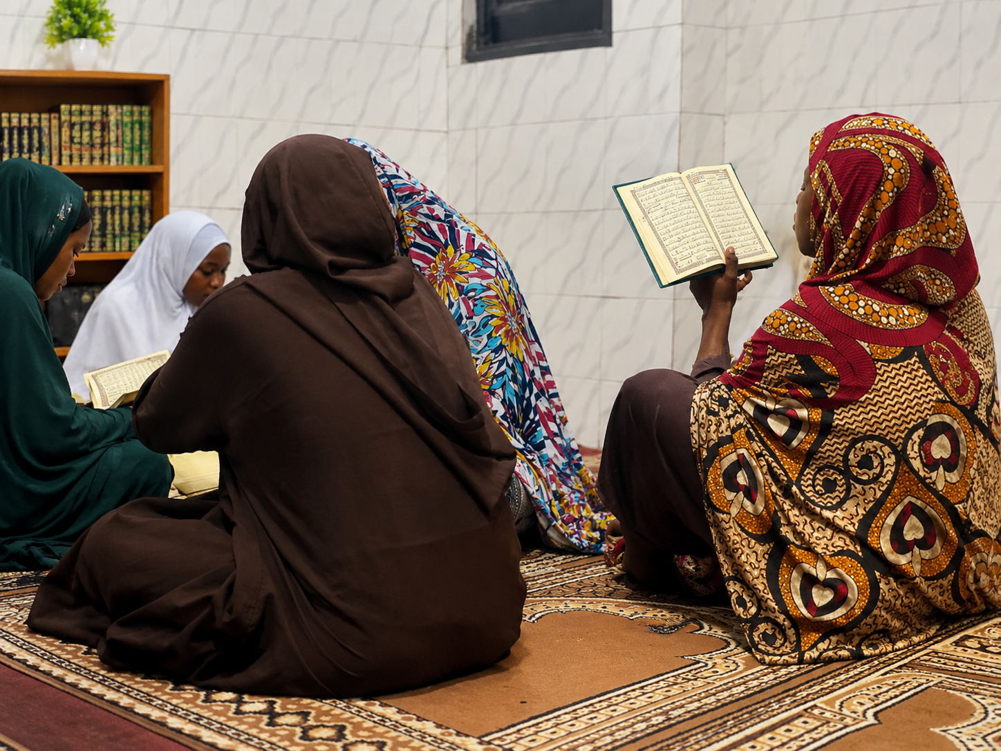 Ghanaian students and teacher in an Islamic learning environment